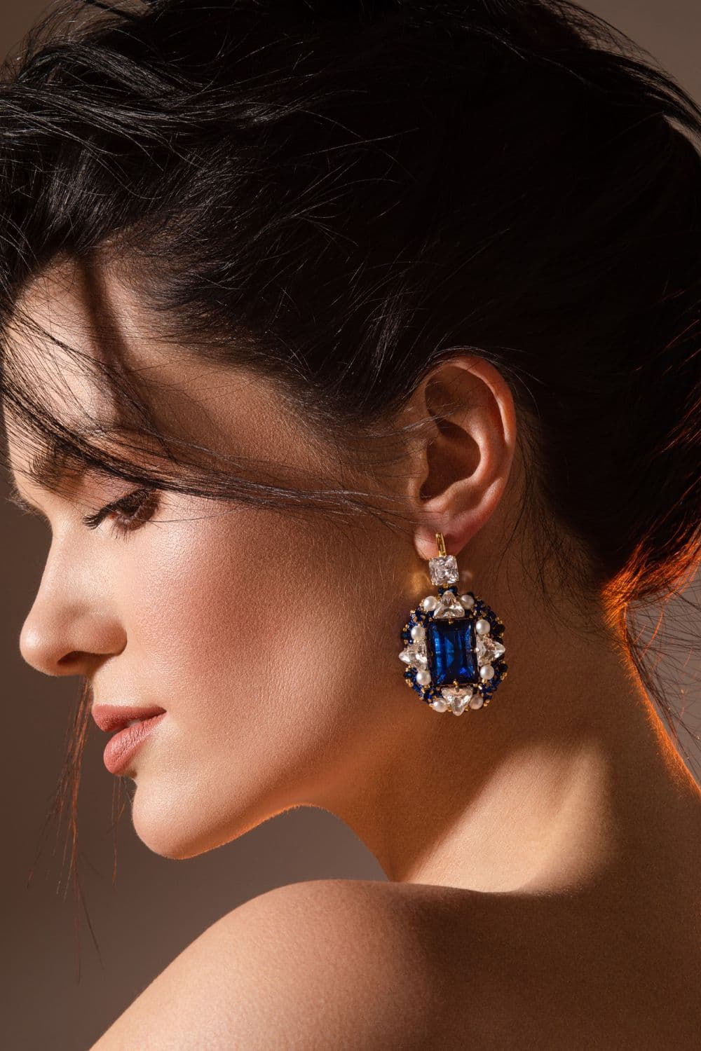 Woman wearing blue sapphire earrings